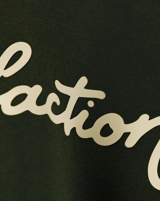 Olive T-shirt with Satisfaction script, angled close-up detail view