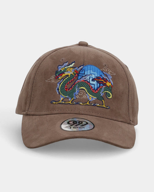 Front view of dragon-embroidery cap on brown suede base.