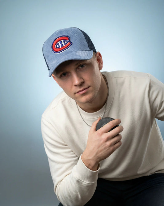 Male wearing a blue Ice Kings Trucker Cap, model shot