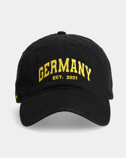 Black cap with ‘Germany EST.2021’ embroidered in yellow on the front.