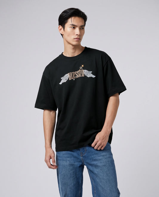 Female model wearing black oversized T-shirt with BLESSED winged text, front view