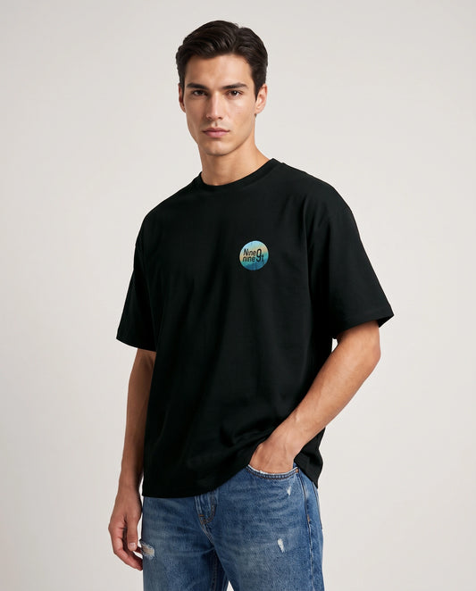 Female model wearing Mystic Dance oversized T-shirt with Nine9nineT chest graphic, front view