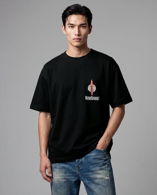Male model wearing Tokugawa oversized T-shirt with Nine9nineT chest graphic, front view