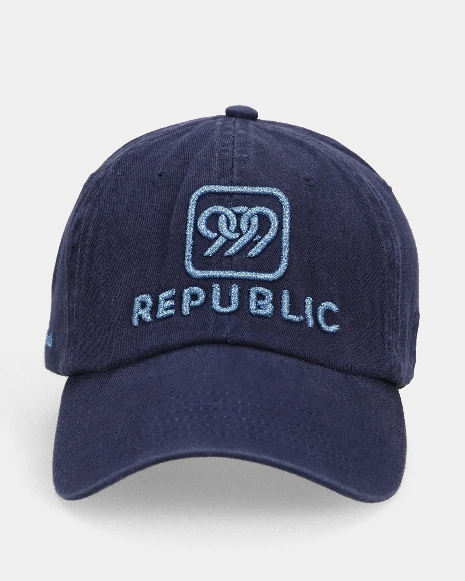 Navy dad cap with REPUBLIC embroidery, front view