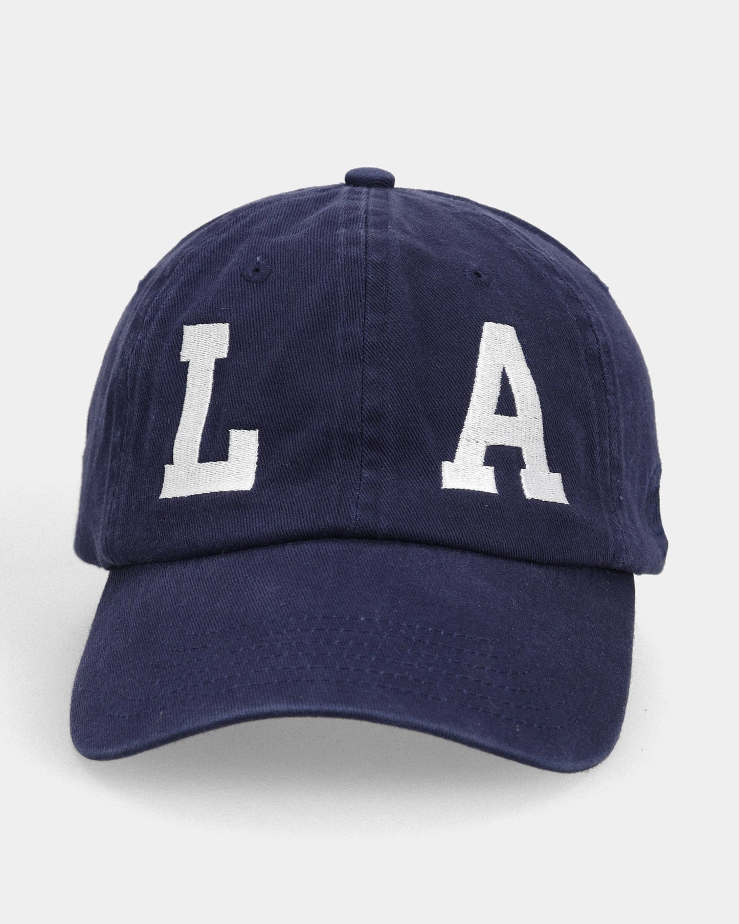 Navy cap with white LA embroidery, front view product shot