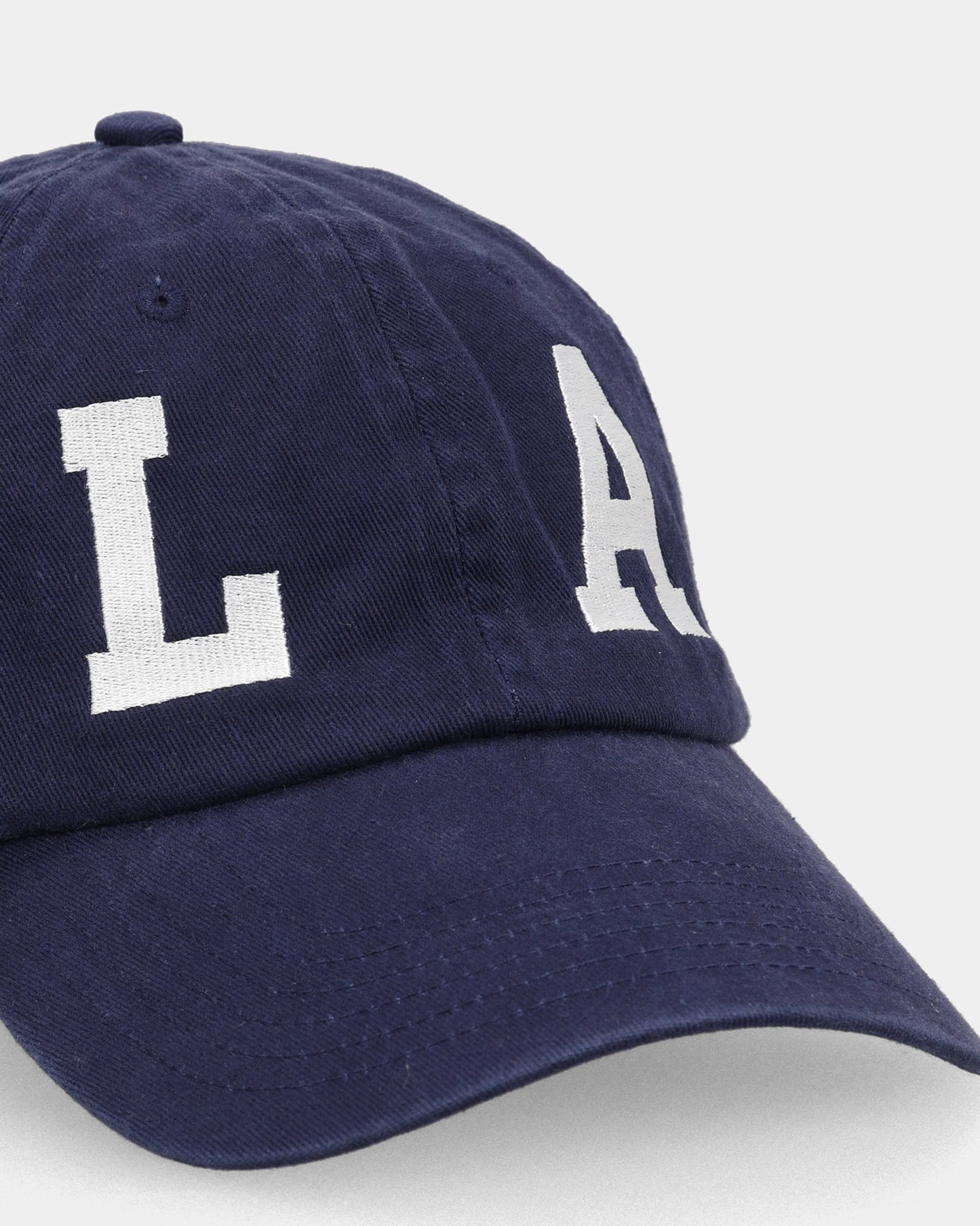 Navy dad cap close-up with LA embroidered front detail