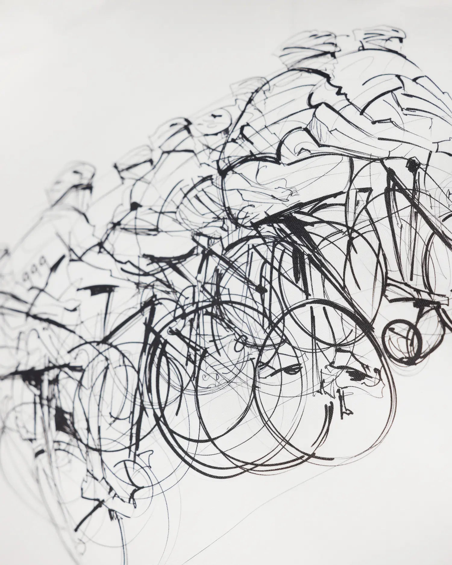 White apparel with bicycle sketch graphic, close-up detail