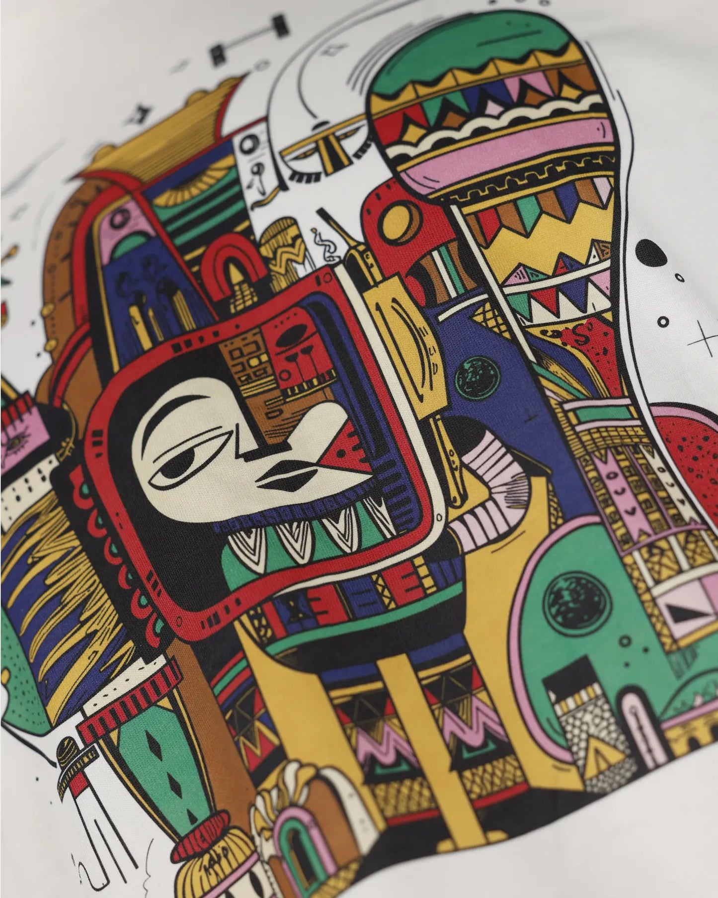 White T-shirt close-up with colourful abstract face graphic detail