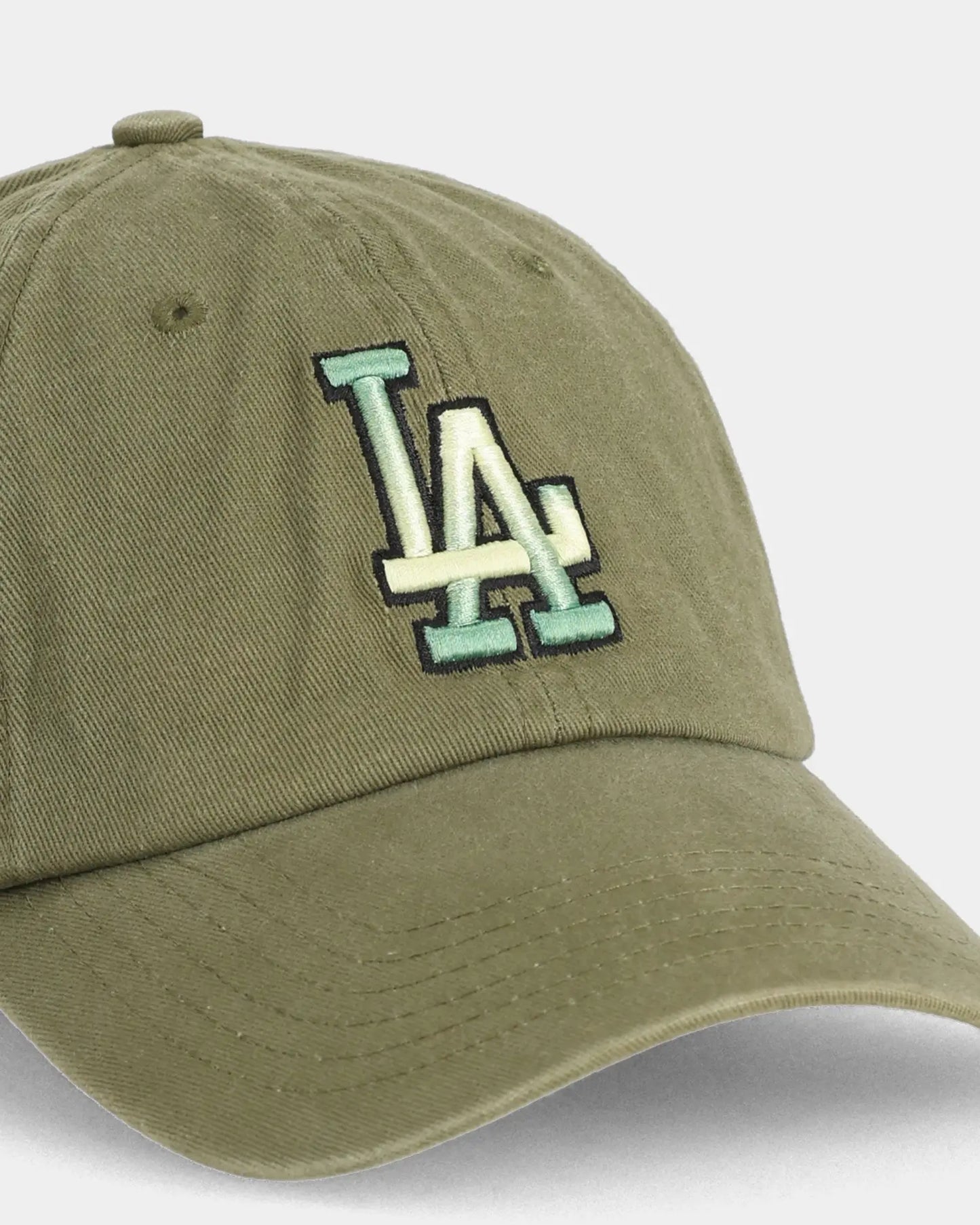 Olive dad cap with LA embroidery, angled front detail view
