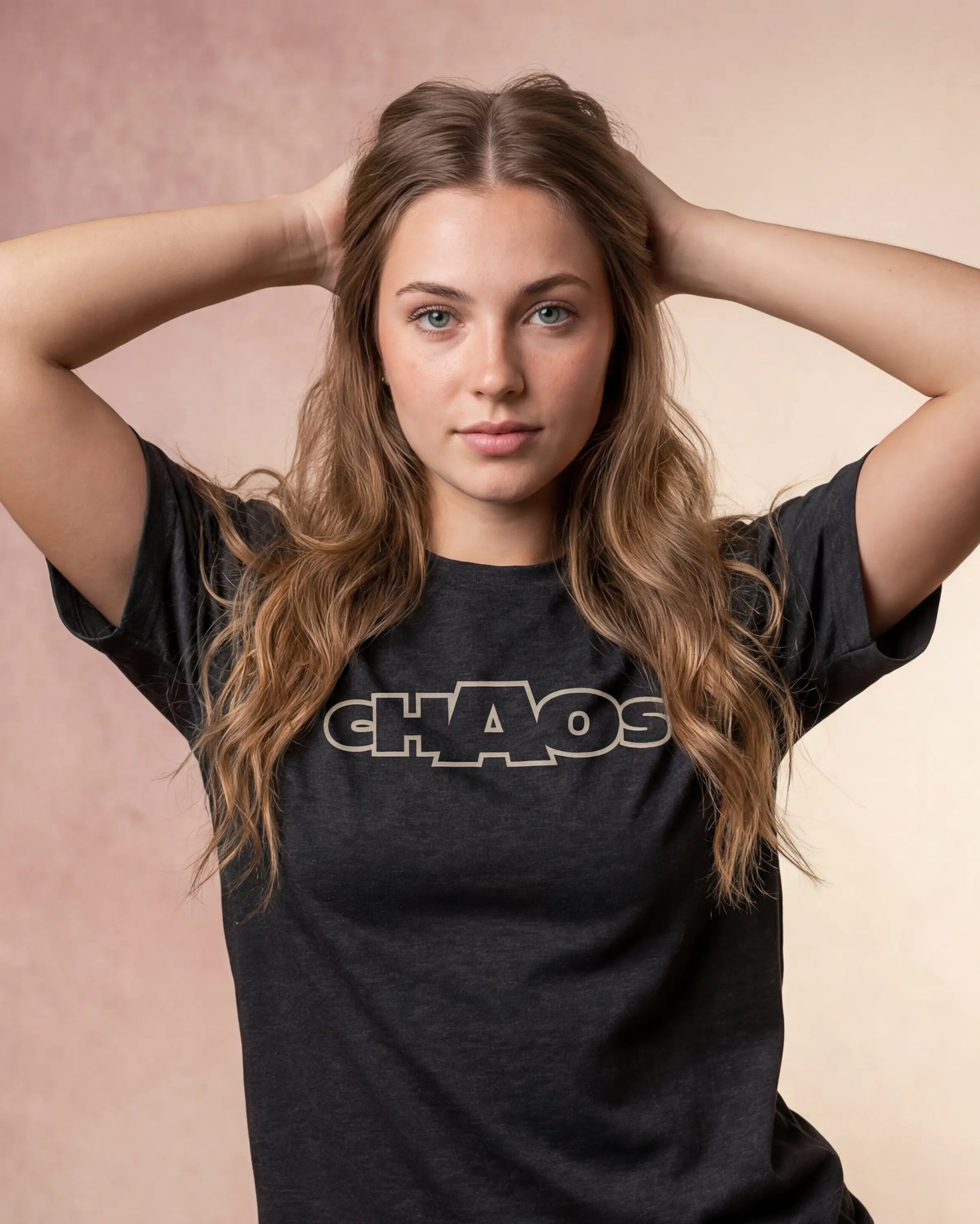 Close-up model wearing charcoal melange t-shirt with CHAOS text, front view shot
