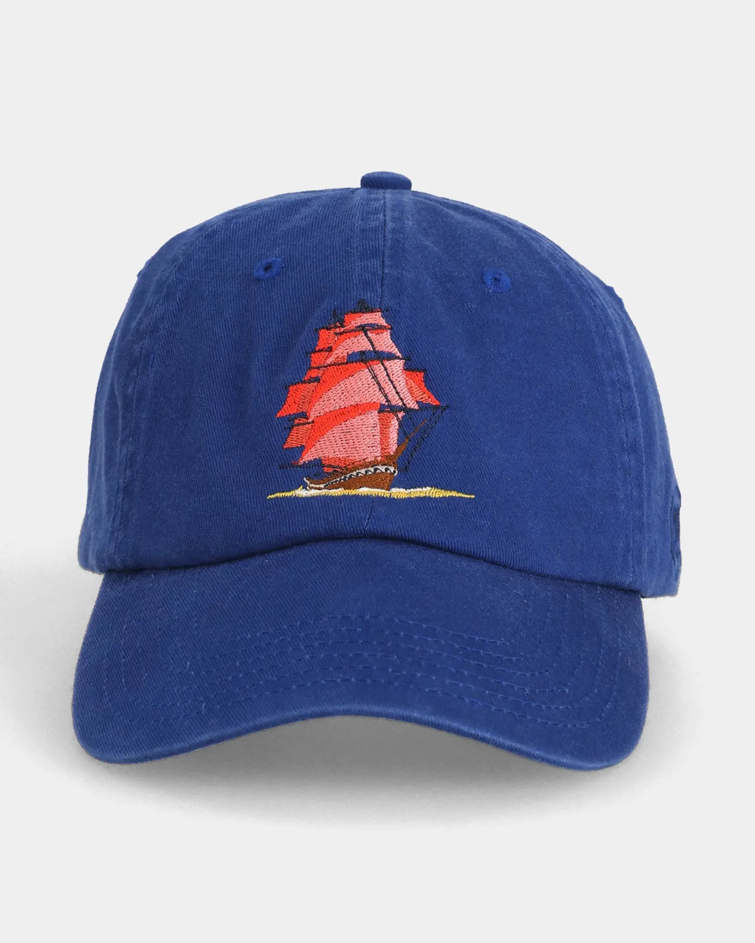 Blue dad cap with red sailboat embroidery, front view