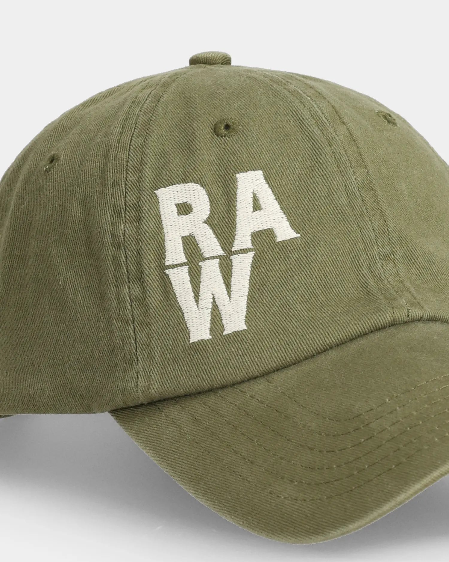 Olive dad cap close-up with white RAW embroidered front detail