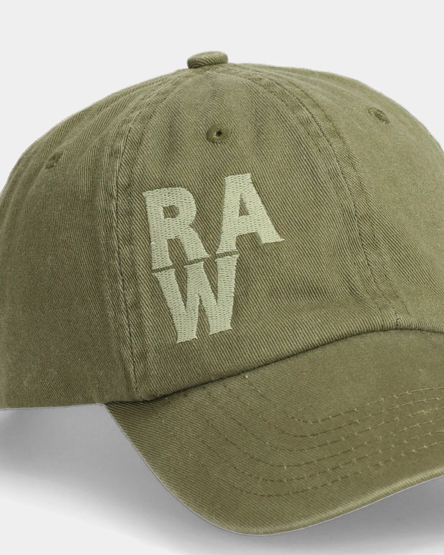 Olive dad cap close-up with green RAW embroidered front detail