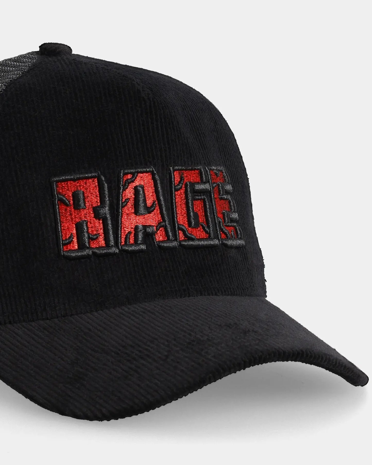 Black trucker cap with RAGE embroidery, angled front detail view