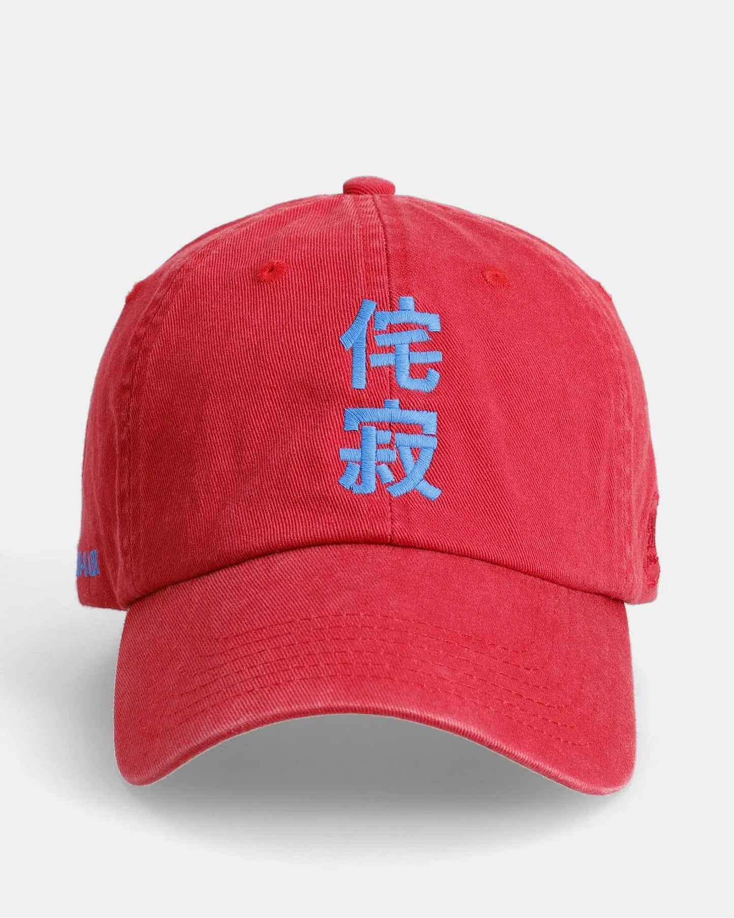 Red Wabi Sabi dad cap front view with blue embroidered character detail