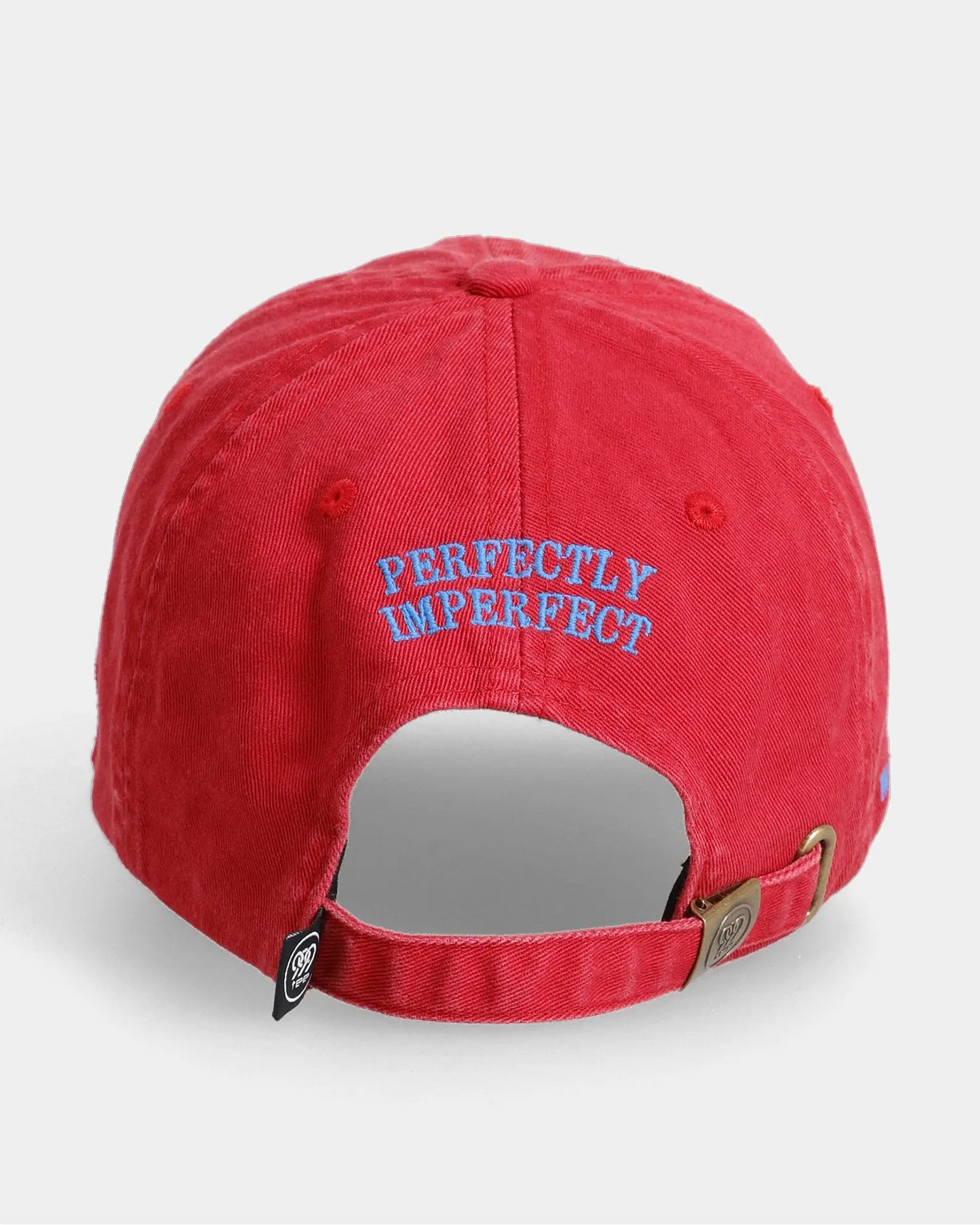 Red dad cap back view with Perfectly Imperfect embroidered text detail