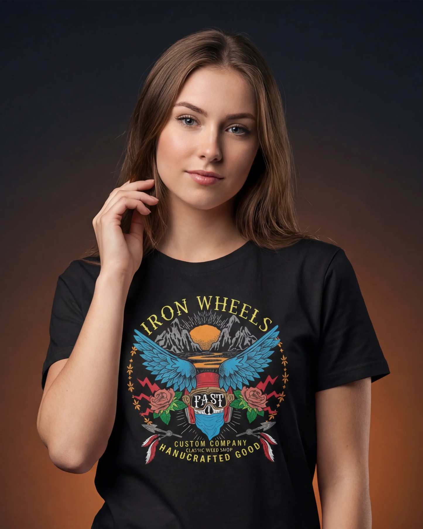 Model wearing a black t-shirt with Iron Wheels graphic print, close-up front view 
