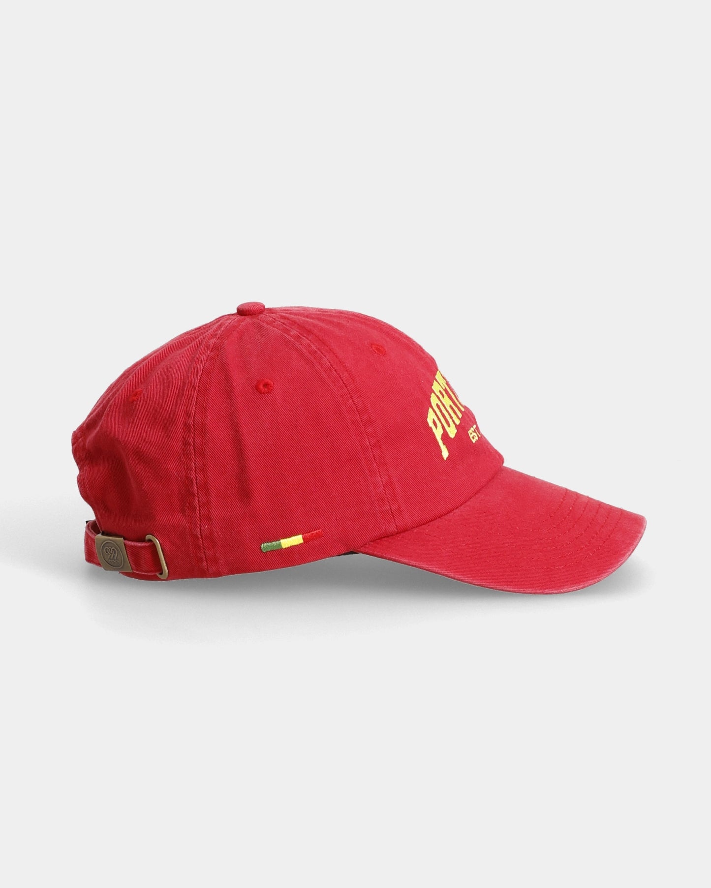 Red dad cap with yellow front embroidery, side view
