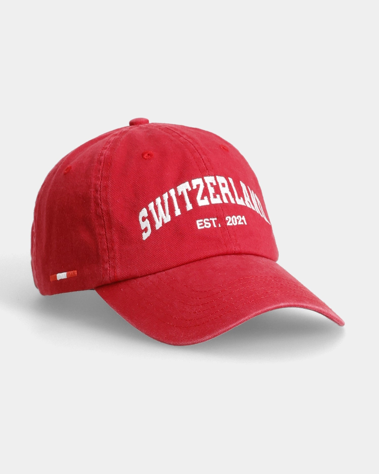 Red Switzerland dad cap angled front view with embroidered text detail