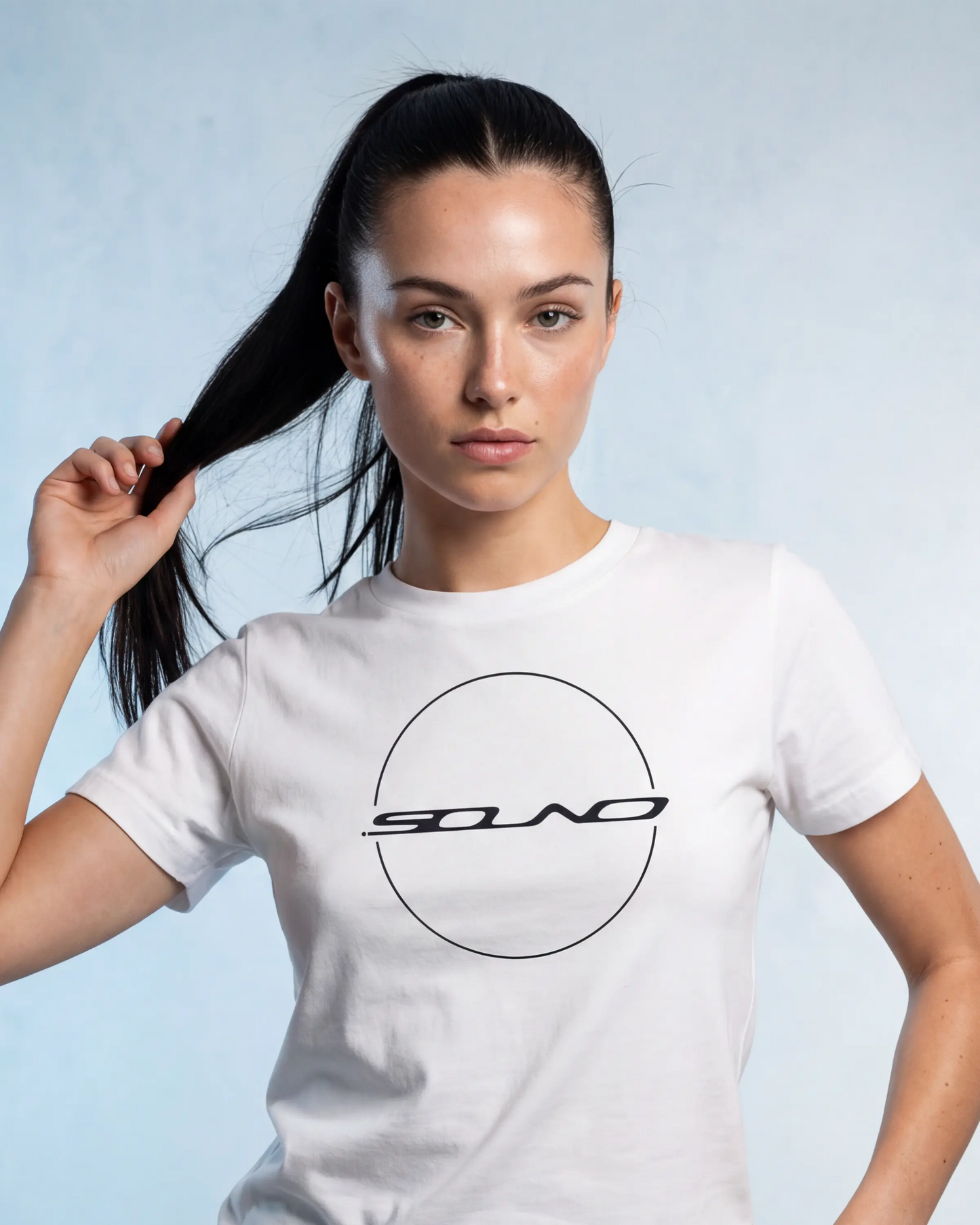 Model wearing a white t-shirt with a round SOUND logo graphic, close-up front view

