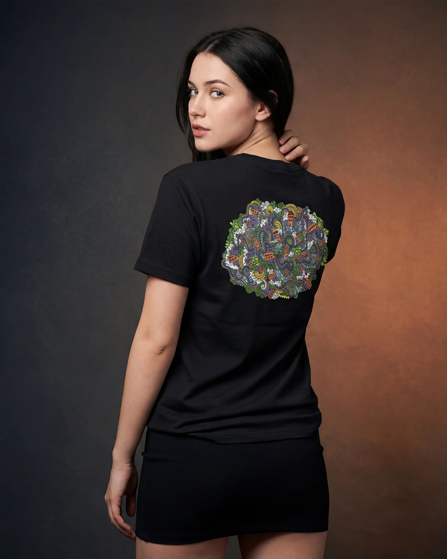 Model wearing black women’s t-shirt with back graphic, back view model shot
