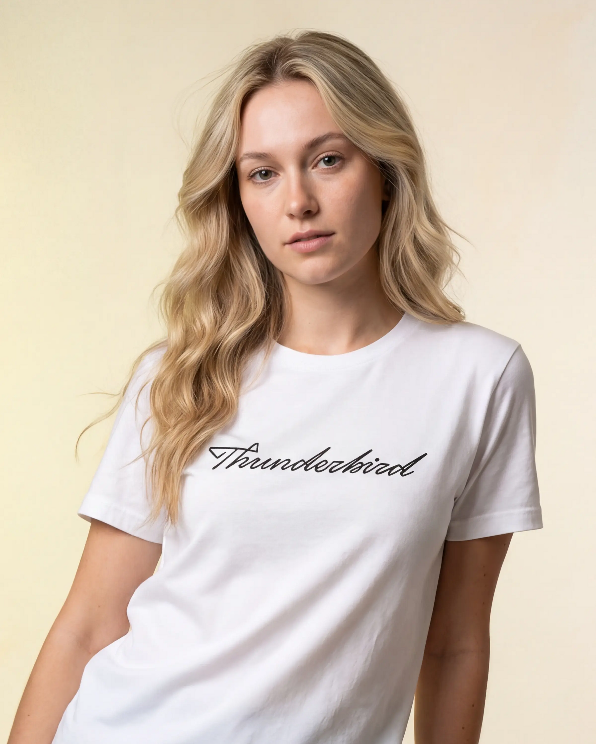 Model wearing white t-shirt with Thunderbird script, front close-up model shot
