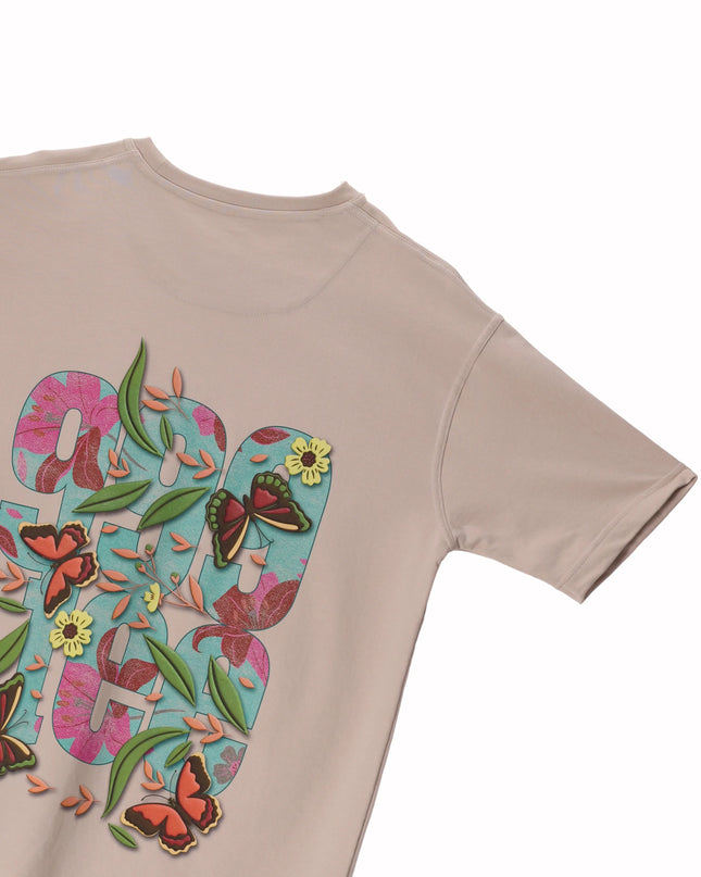 Back Image of beige coloured oversized women's t-shirt with butterfly design print on back 