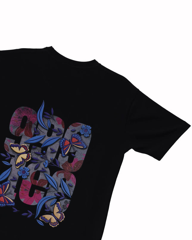 image of back print 999Tee butterfly design on a black coloured oversized t-shirt.