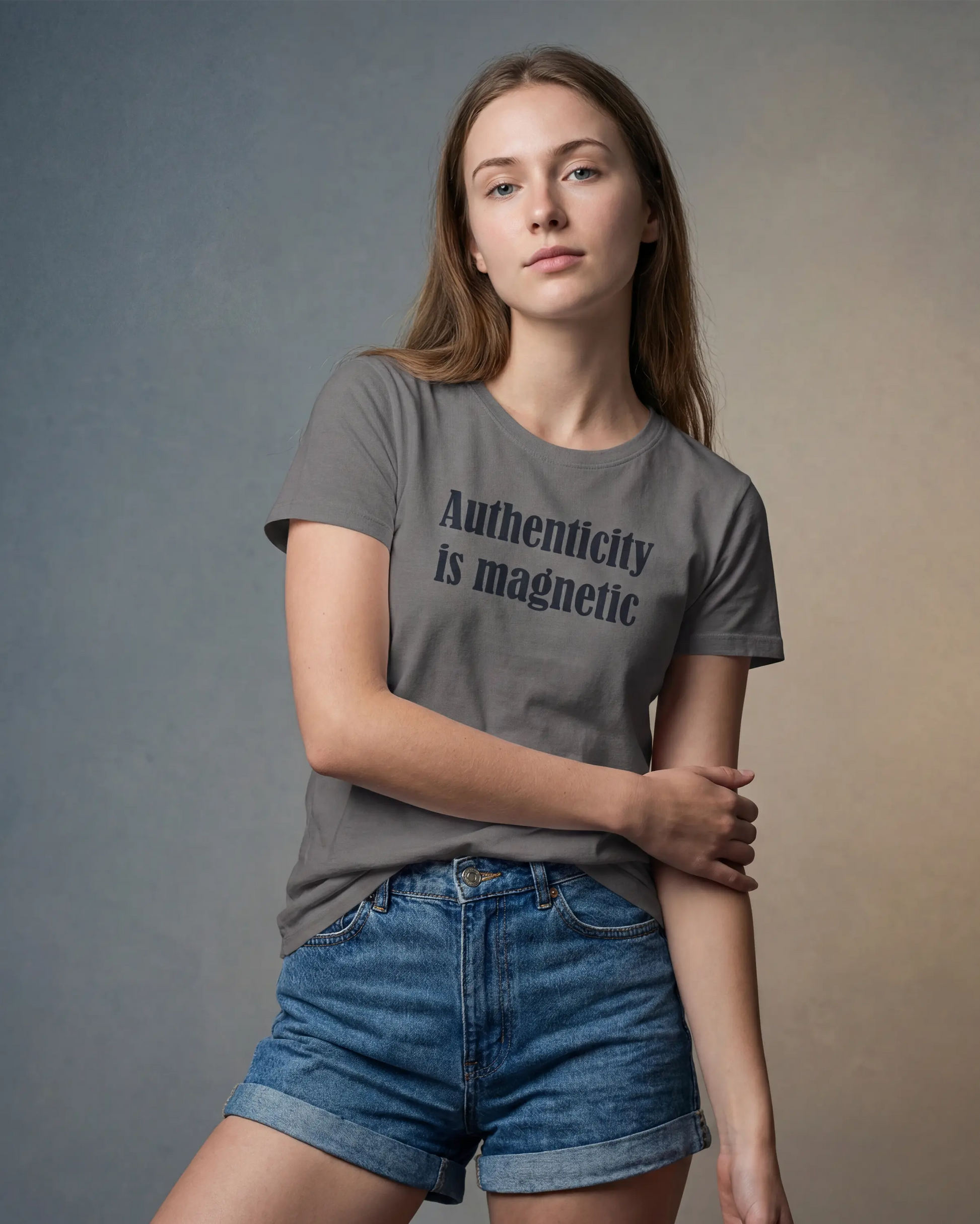 Model wearing asphalt t-shirt with Authenticity is magnetic text, front view model shot
