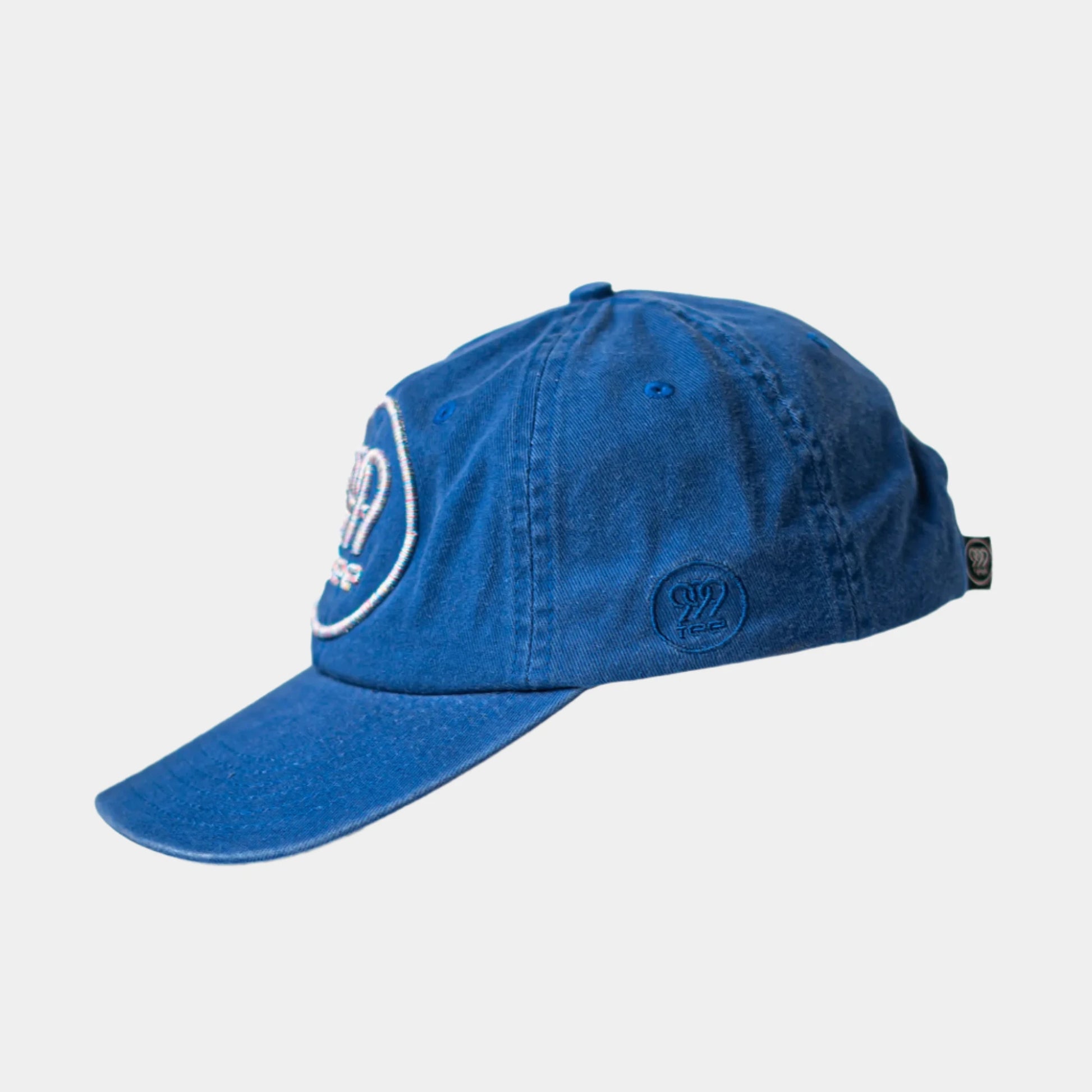 999Tee blue colored dad cap with 999tee logo 3d puff embroidery on it using multicoloured thread.