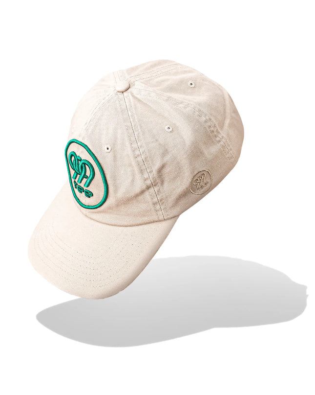 999Tee beige coloured dad cap with 3D Puff embroidered 999tee logo with jungle green coloured thread.