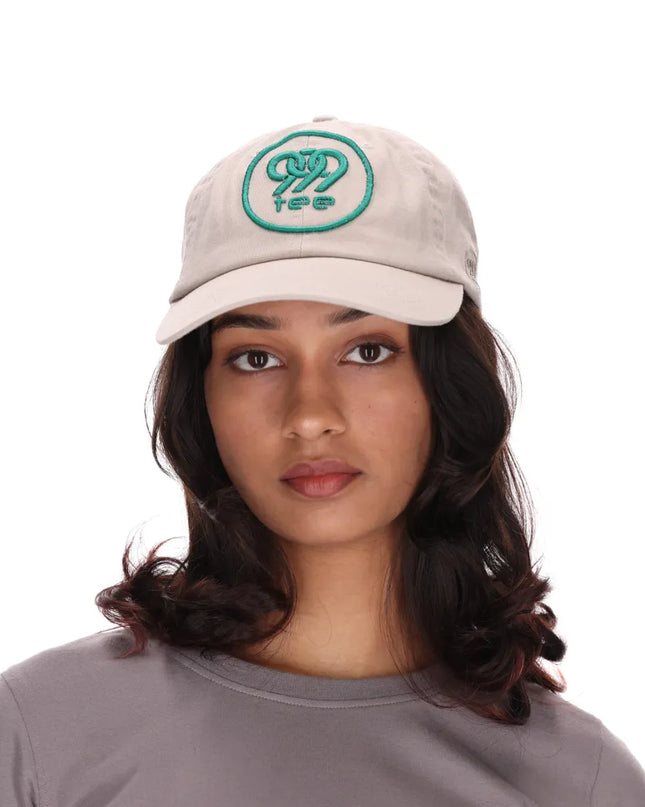 999Tee beige coloured dad cap with 3D Puff embroidered 999tee logo with jungle green coloured thread.