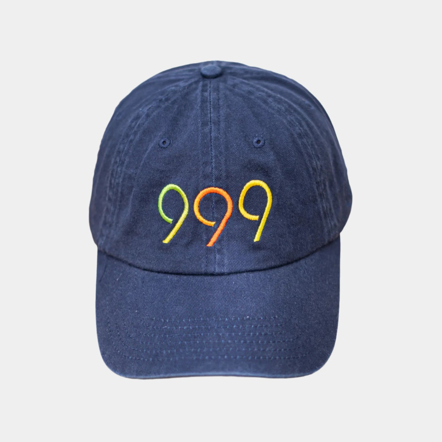 999Tee navy coloured dad cap with 999 embroidered on it with a colour gradient using coloreel technology.