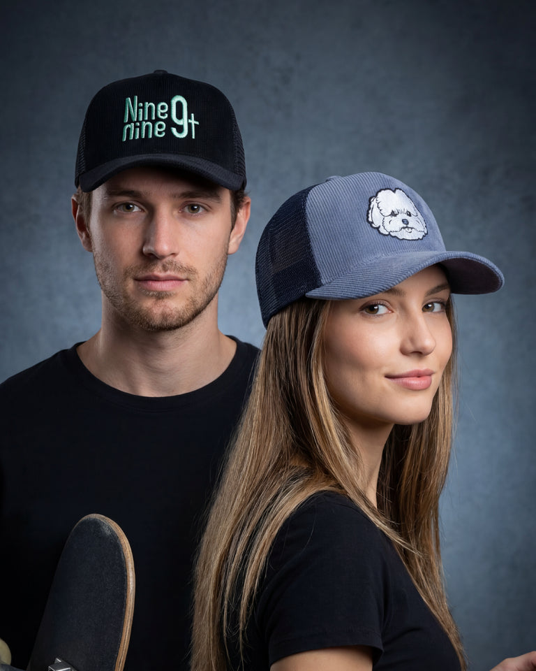 Male and female models wearing Nine Nine 9t and Lil Floof trucker caps
