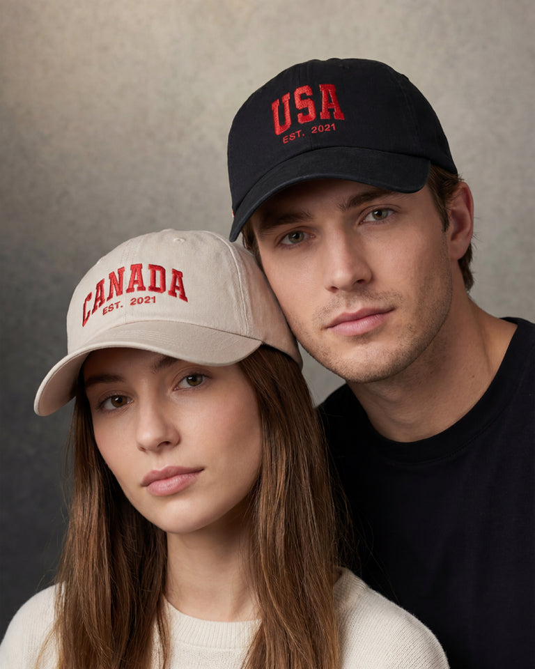 Female and male models wearing khaki Canada and black USA dad caps