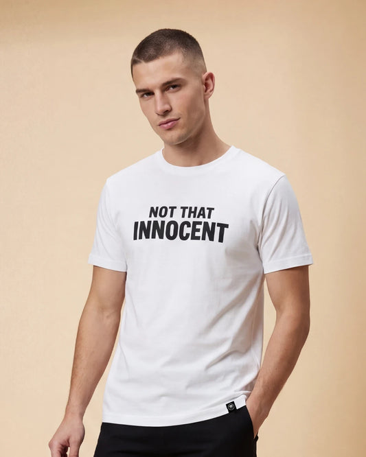 Male model wearing white T-shirt with Not That Innocent text, front view