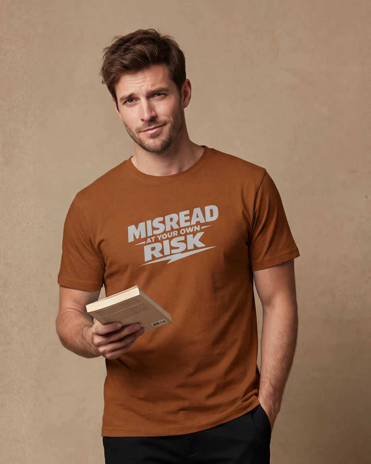 Male model wearing new toast t-shirt with MISREAD AT YOUR OWN RISK text, front view
