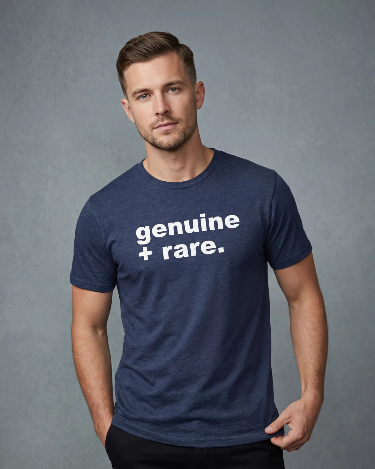 Male model wearing a denim melange t-shirt with genuine + rare text, front view, model
