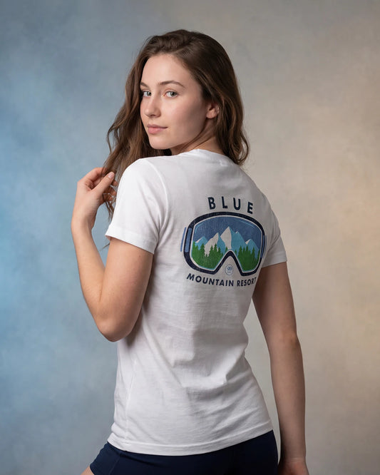 Model wearing white t-shirt with BLUE MOUNTAIN RESORT back graphic, back view model shot
