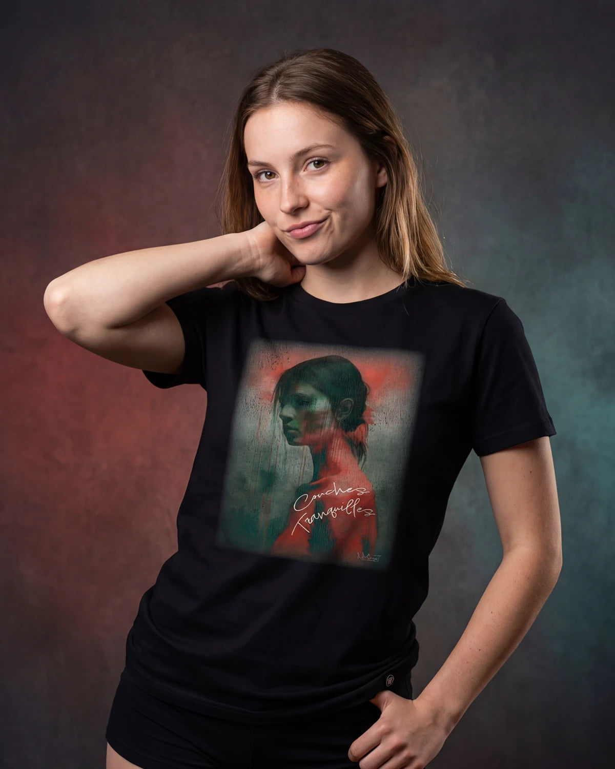 Model wearing a black t-shirt with a portrait graphic, front view, Tranquil Layers