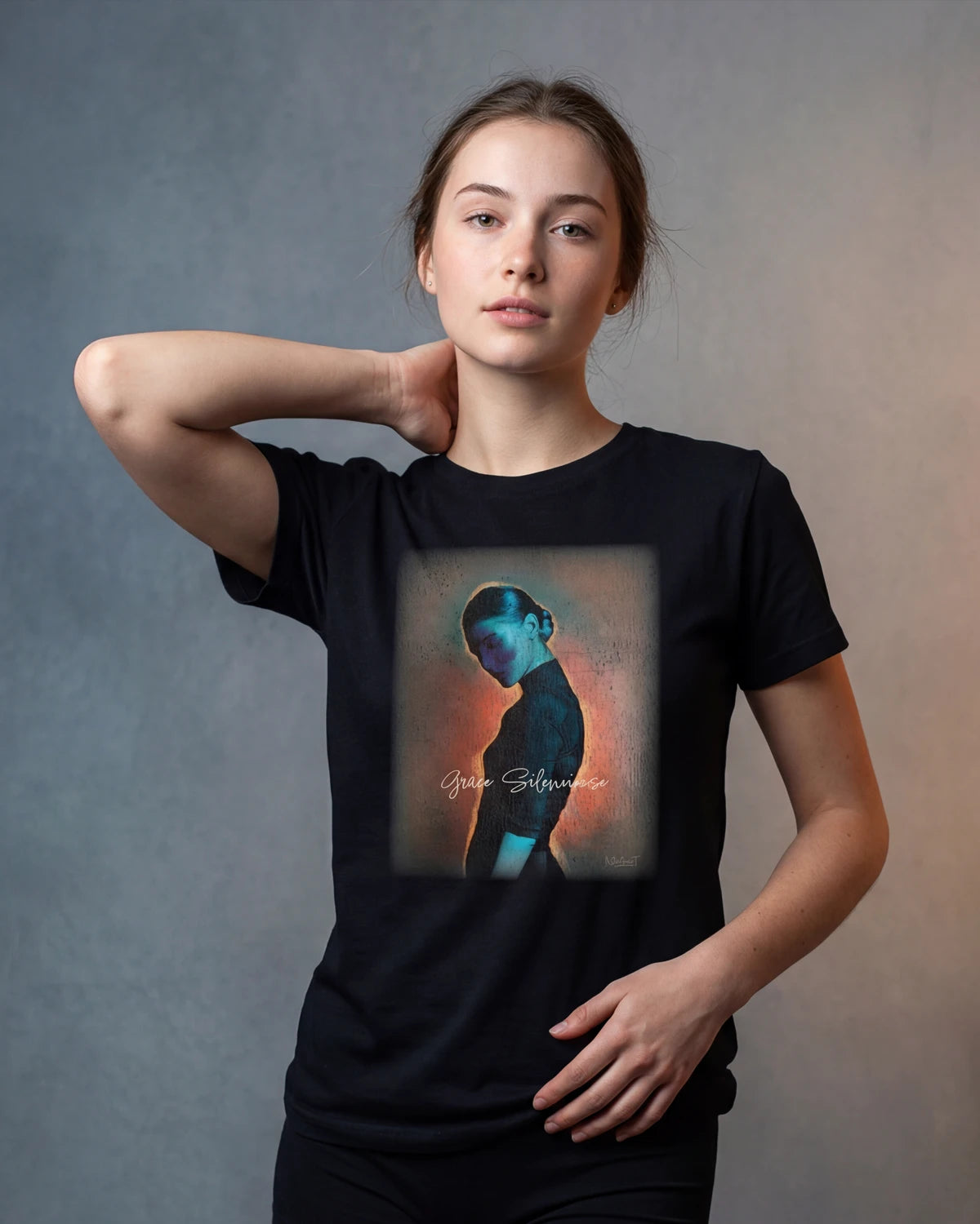 Model wearing black t-shirt with portrait graphic, front view, Silent Grace