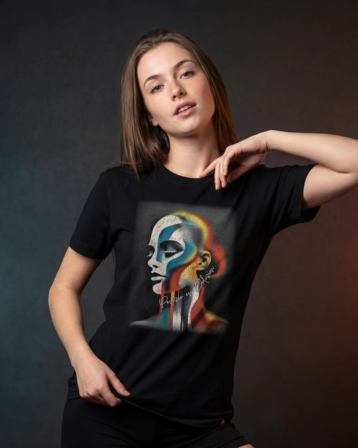 Model wearing black Thought in Bloom t-shirt with abstract face graphic, front view
