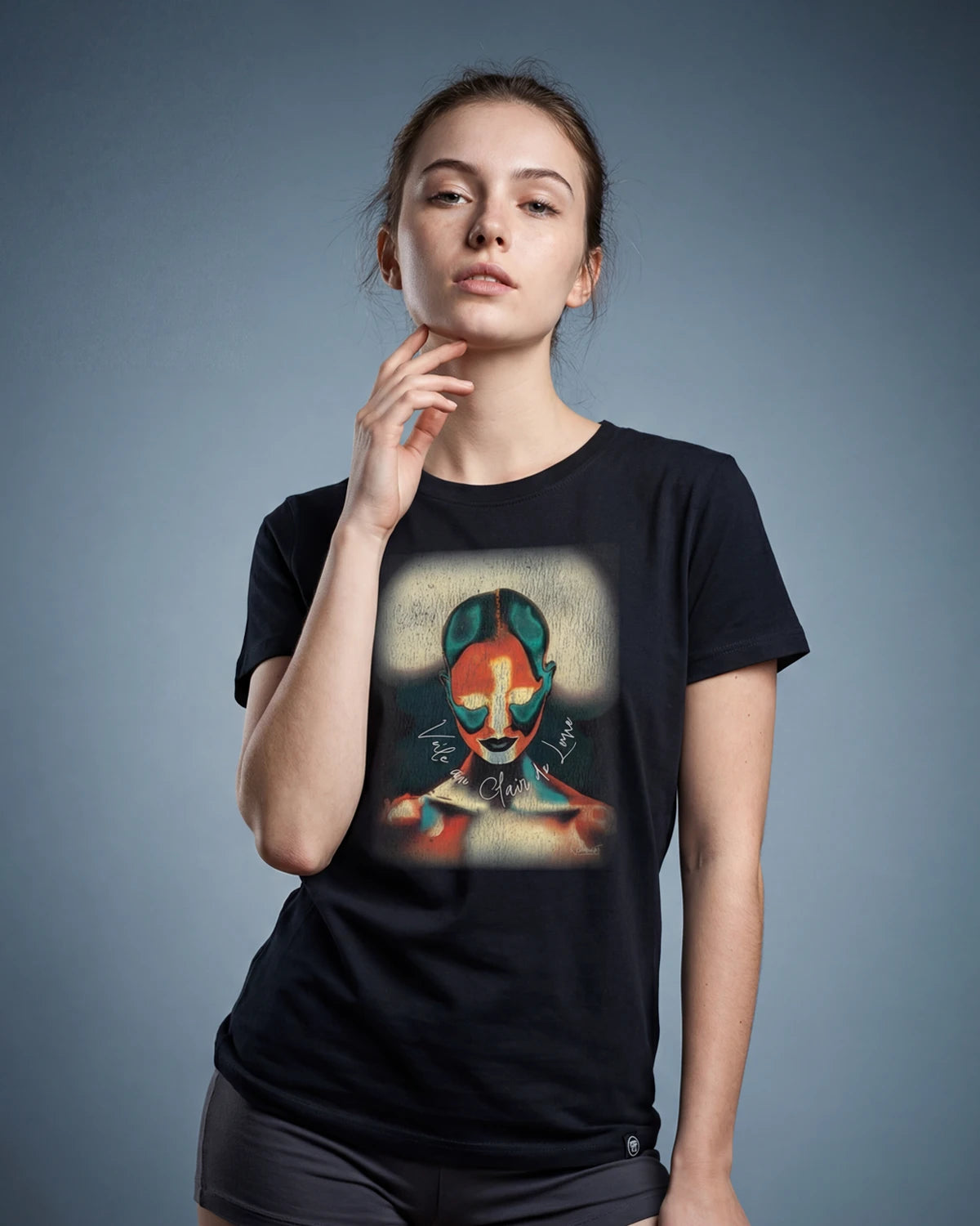 Model wearing black Moonlit Veil t-shirt with abstract portrait graphic, front view
