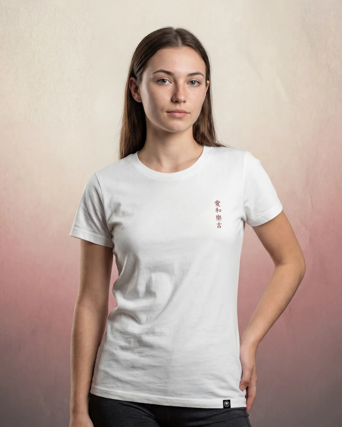 Midnight Bloom white t-shirt with small vertical chest print, model front view