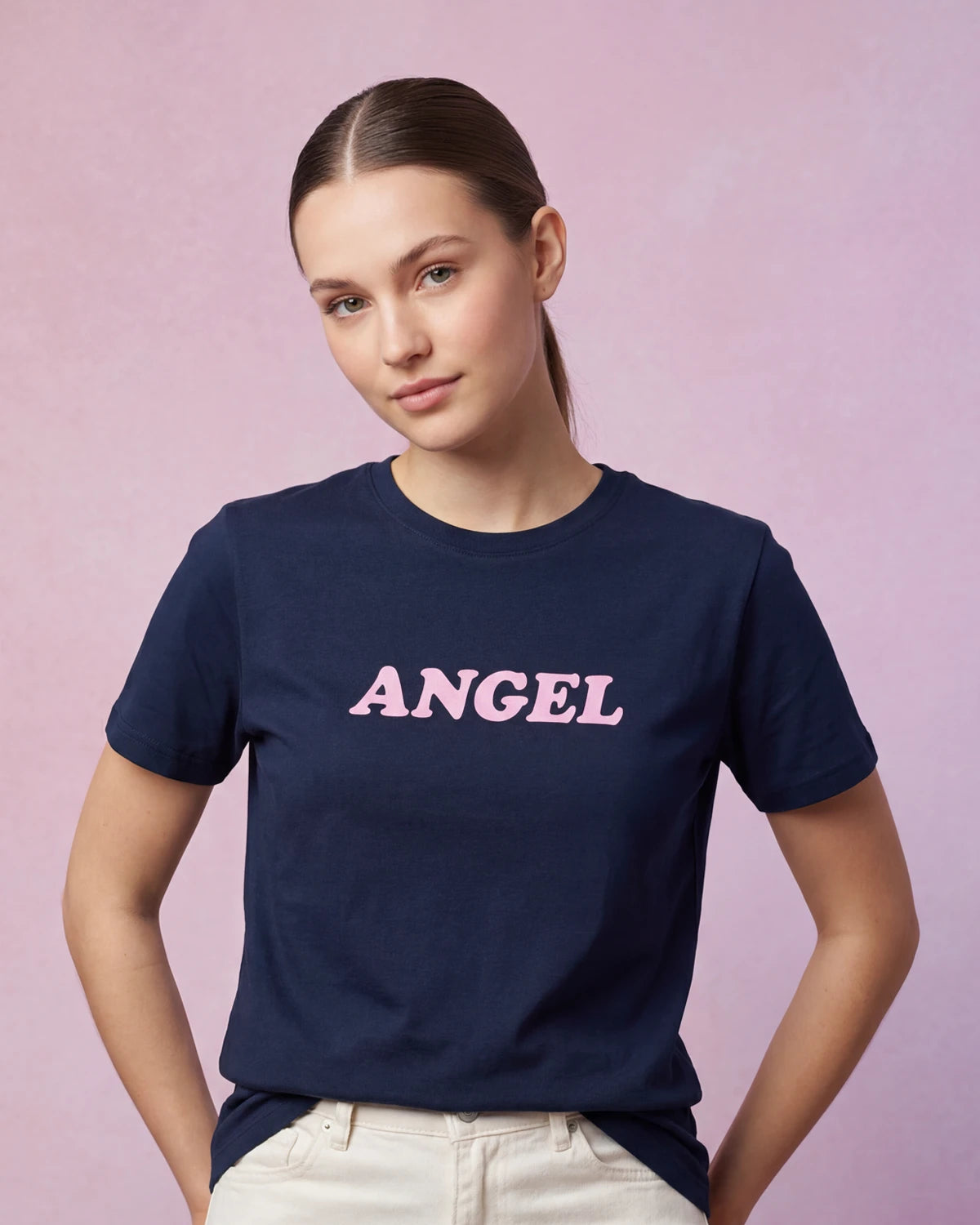 Model wearing navy t-shirt with ANGEL text, front view
