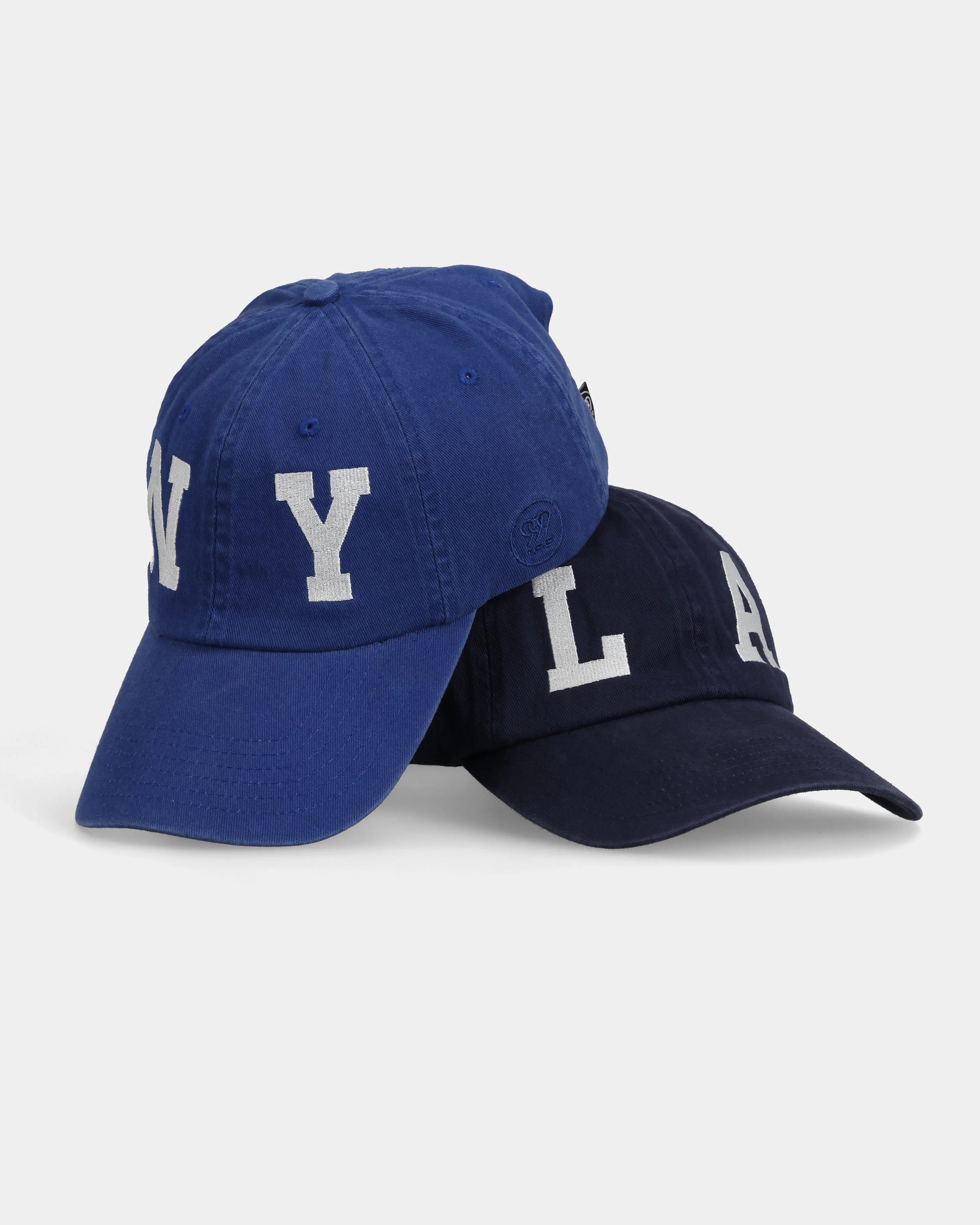 NY#05 and LA#03 Dad Caps, stacked front product shot with embroidery