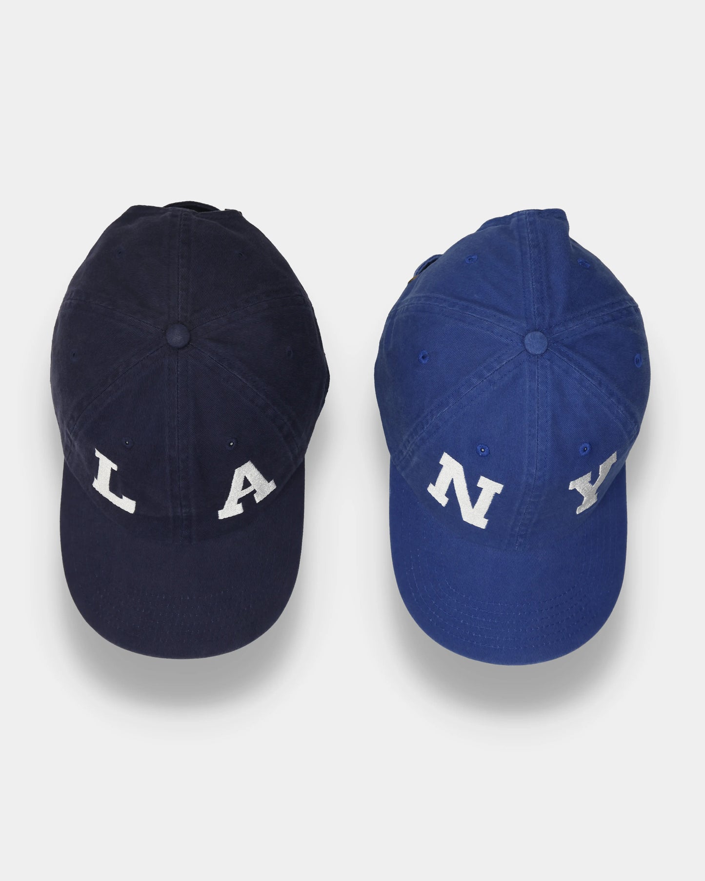 NY#05 and LA#03 Dad Caps, top view comparison with letter embroidery
