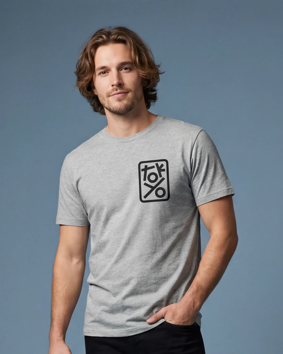 Male model wearing grey melange t-shirt with TOKYO graphic, front view
