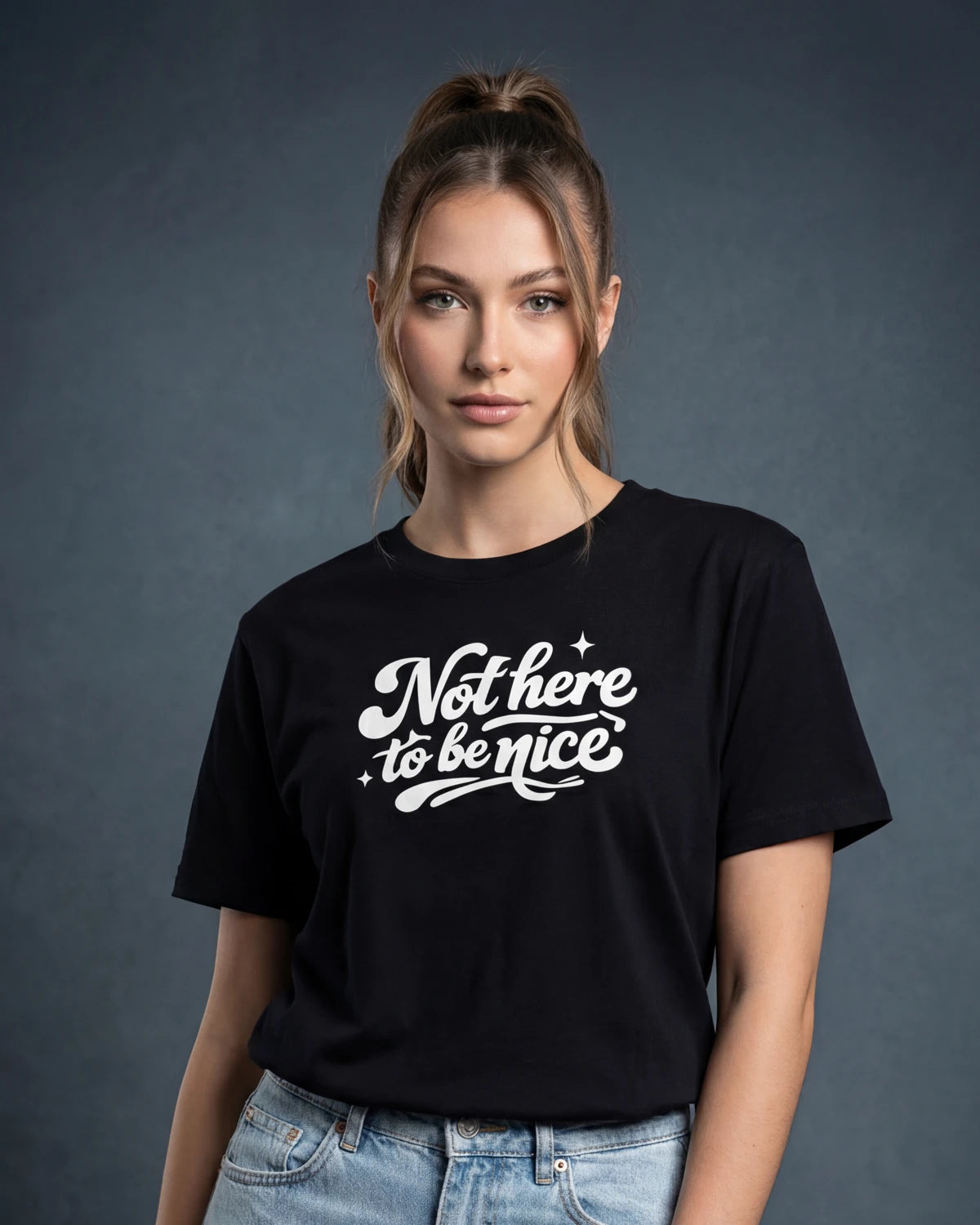 Model wearing black t-shirt with Not here to be nice text, front view model shot
