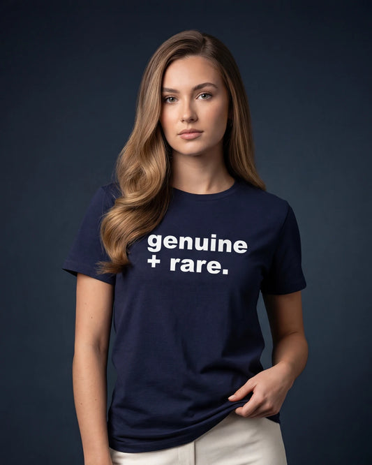 Model wearing denim melange t-shirt with genuine + rare. text, front view model shot
